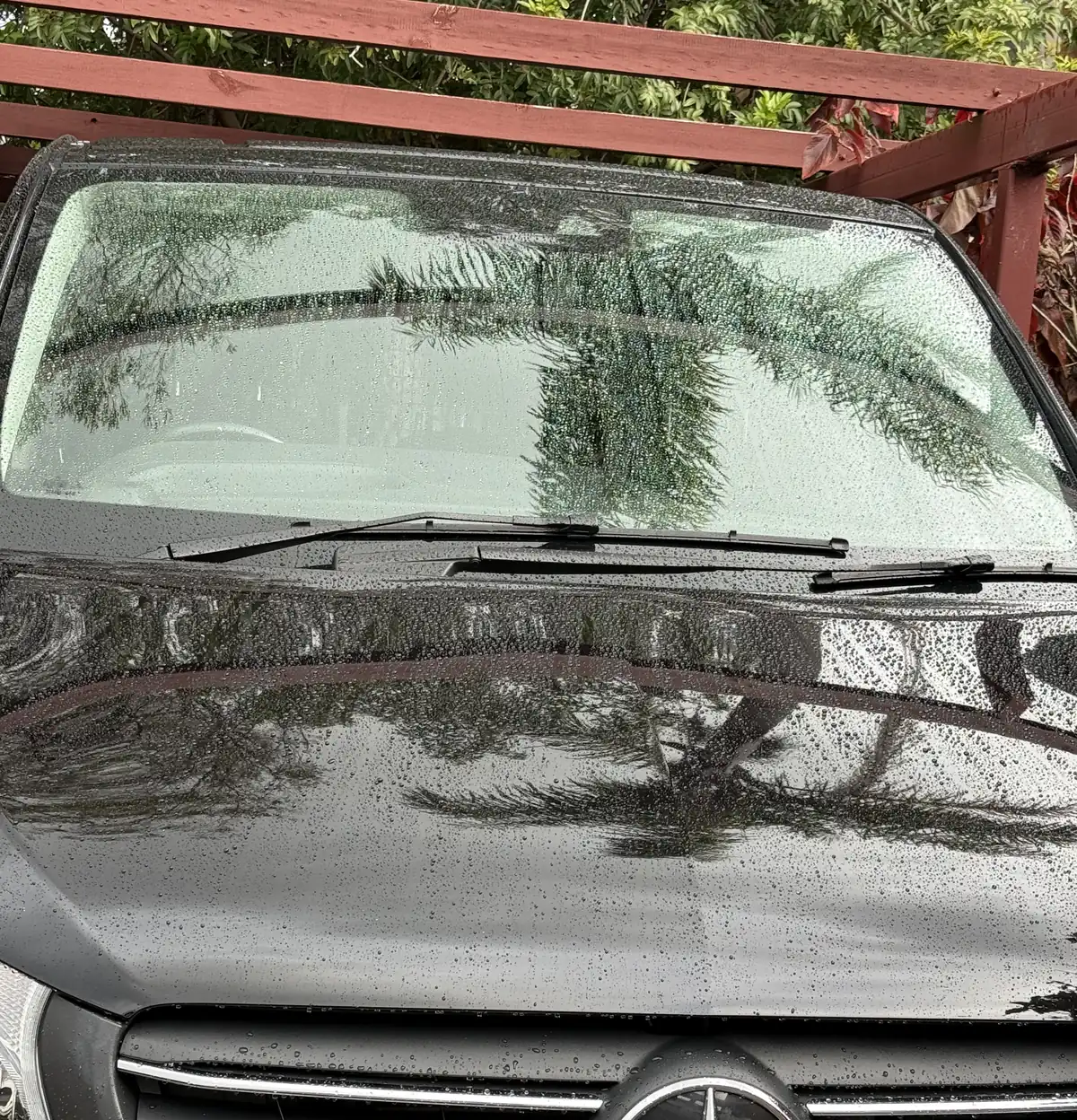 Rain beading on the Gtechniq coated windscreen and ceramic coated bonnet of the Aurex van